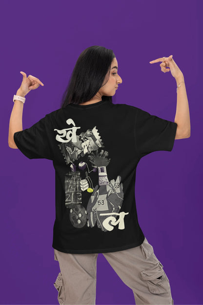 Back view of a female model wearing a black oversized t-shirt featuring a collage of illustrations or symbols representing various childhood games commonly played by kids in India.