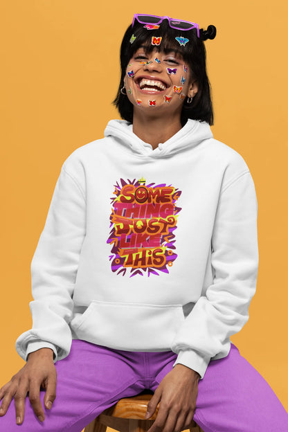 Third front view of a female model wearing an off-white hoodie featuring the designs inspired from Coldplay's "Something Just Like This" music video.