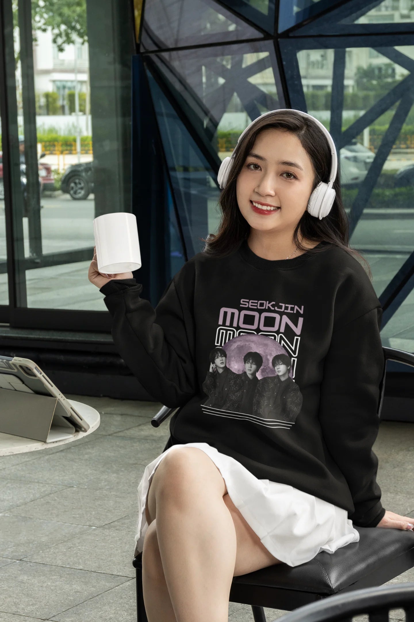Second front view of female model wearing an black sweatshirt featuring a unique design inspired by BTS member Jin, also known as "Worldwide Handsome." Ideal for fans of BTS and K-Pop music enthusiasts in general. 