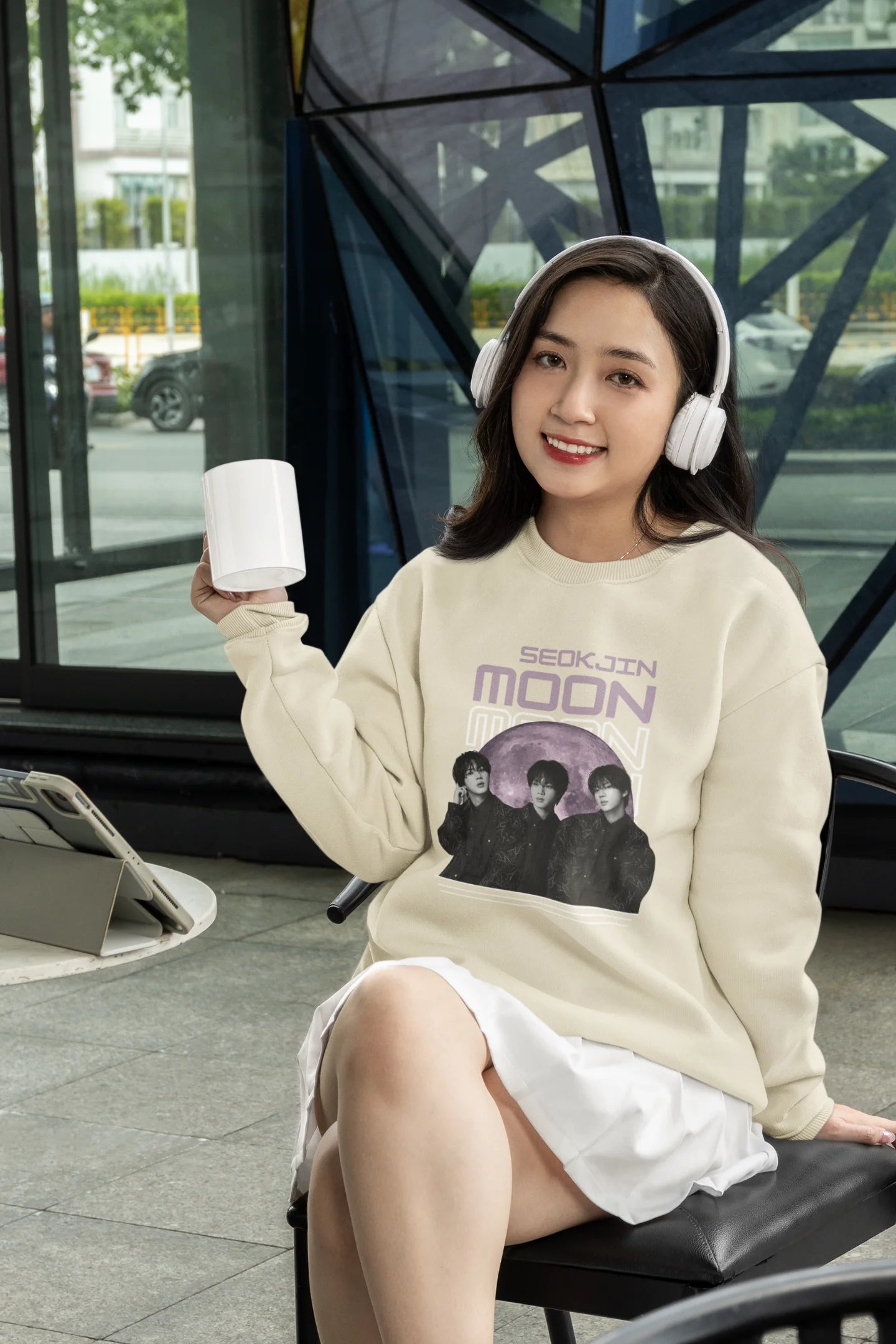 Fourth front view of female model wearing an cream sweatshirt featuring a unique design inspired by BTS member Jin, also known as "Worldwide Handsome." Ideal for fans of BTS and K-Pop music enthusiasts in general. 