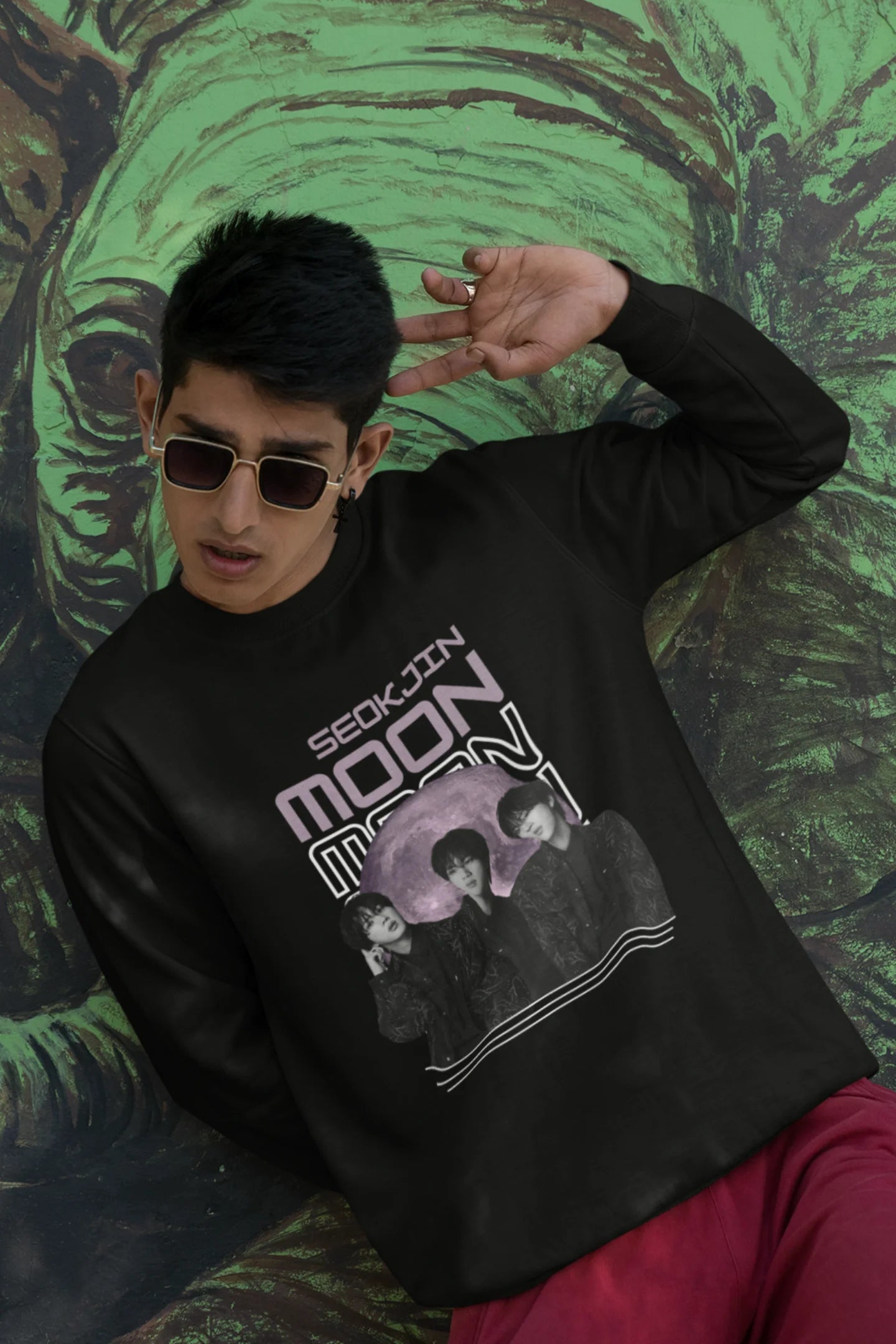 First front view of male model wearing an black sweatshirt featuring a unique design inspired by BTS member Jin, also known as "Worldwide Handsome." Ideal for fans of BTS and K-Pop music enthusiasts in general. 