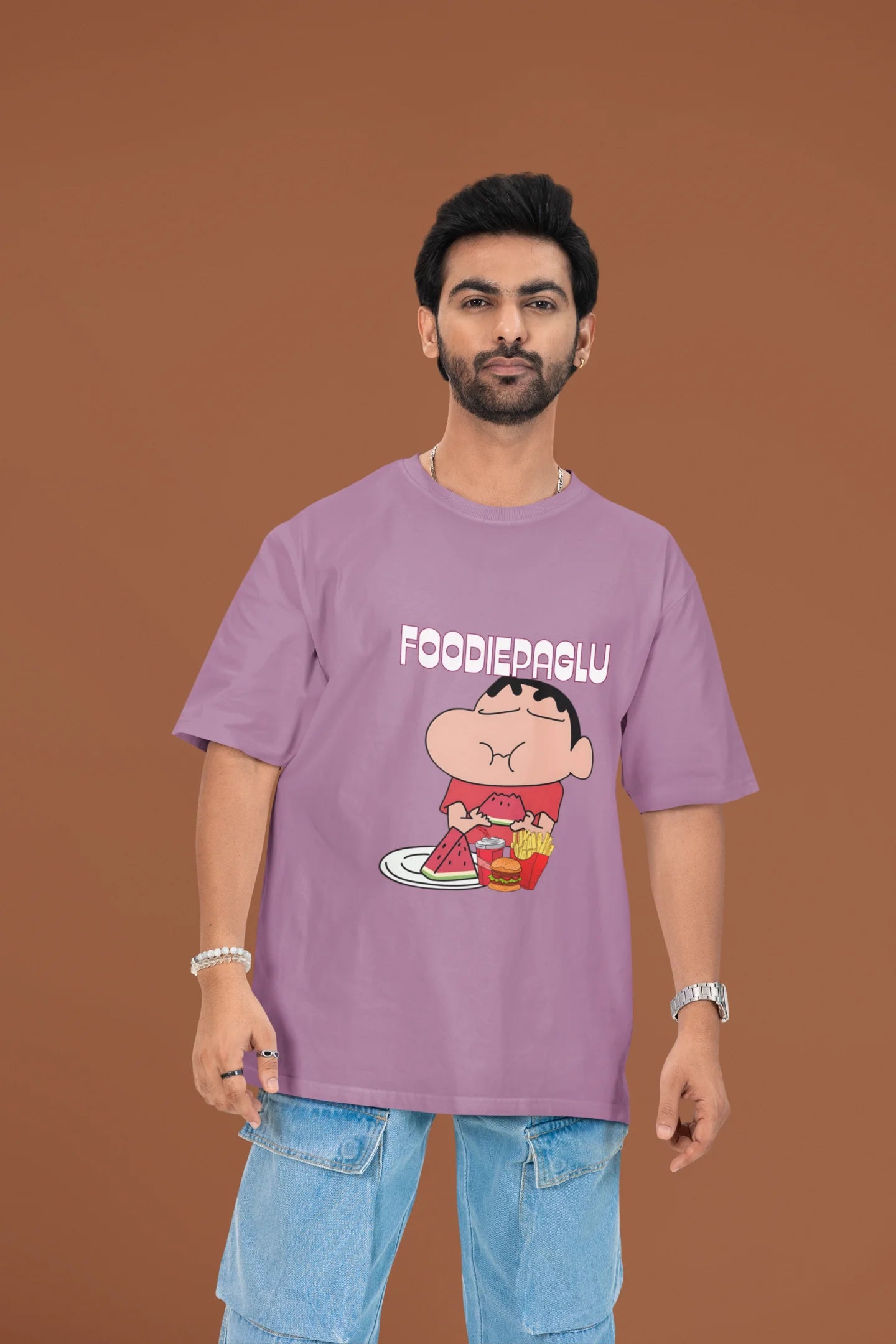 2nd front of a male view model wearing  a dirty purple oversized t-shirt featuring Shinchan eating a big meal showing his foodie side.