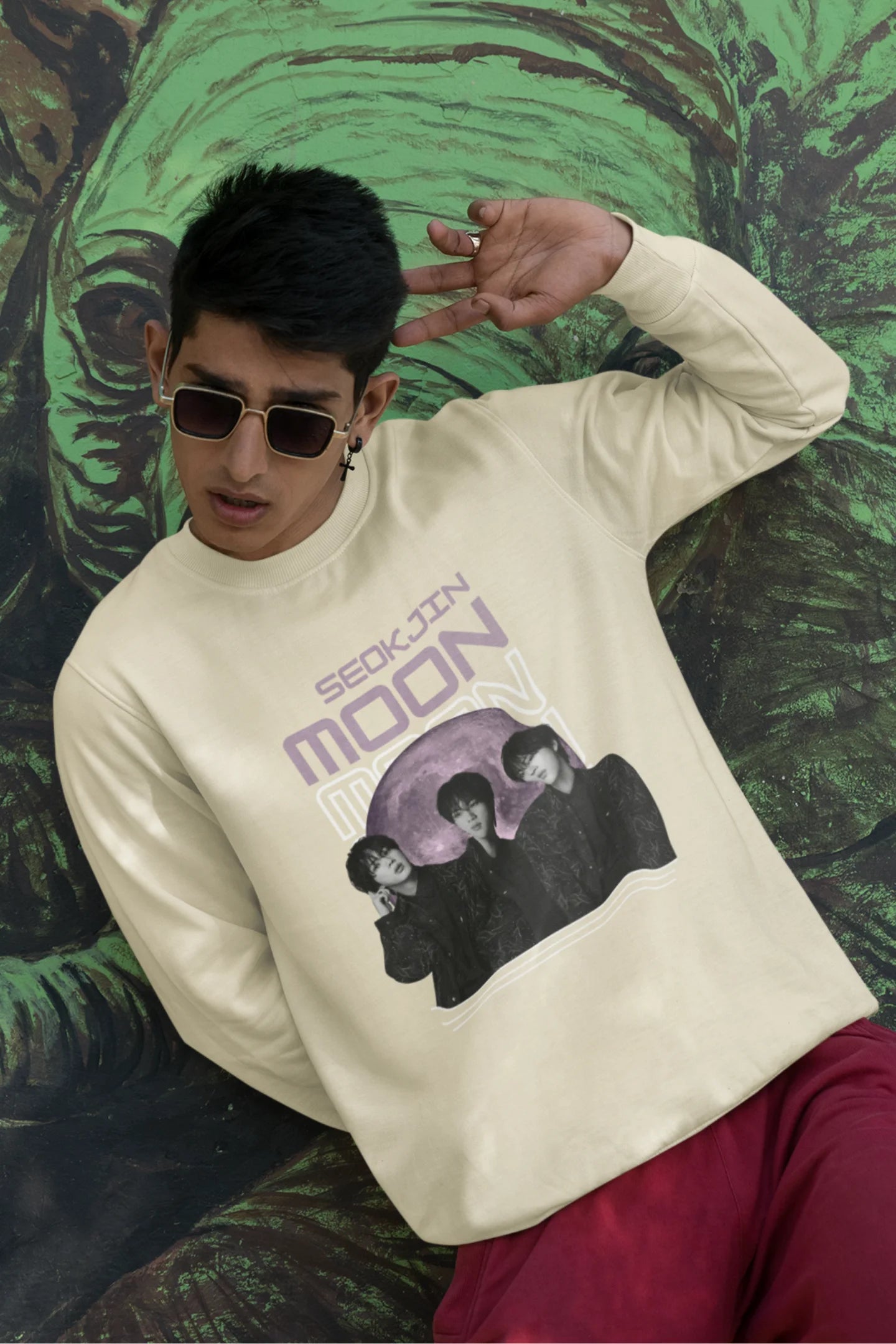 First front view of male model wearing an cream sweatshirt featuring a unique design inspired by BTS member Jin, also known as "Worldwide Handsome." Ideal for fans of BTS and K-Pop music enthusiasts in general. 