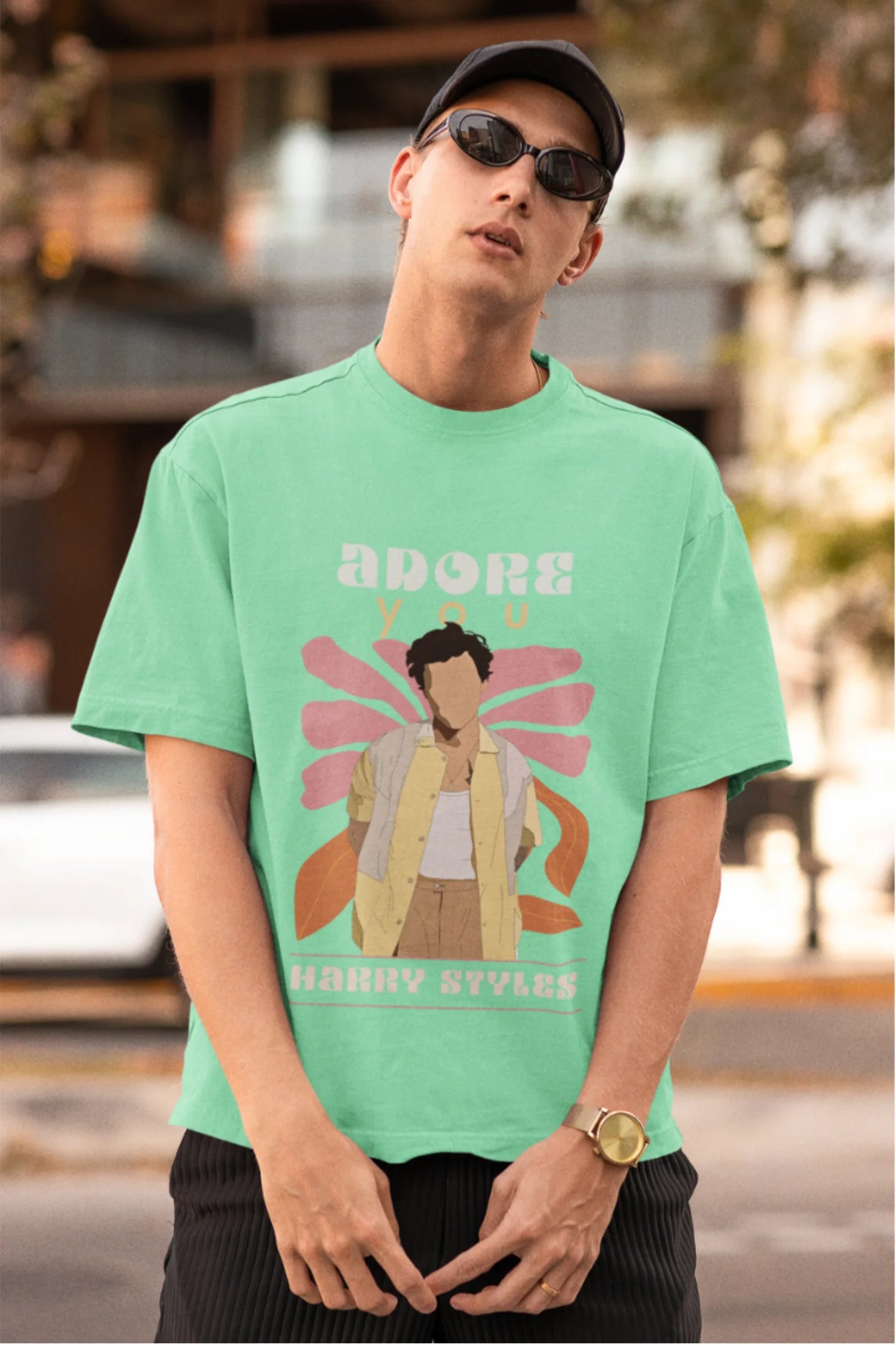 First image of man wearing mint green oversized t-shirt featuring 'Adore You' inspired design - ideal for fans of Harry Styles and One Direction