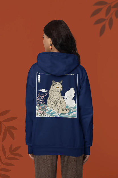 Back view of a female model wearing a navy blue hoodie with a design of a wildcat sitting on ocean waves.