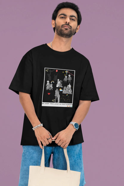 2nd front view of a male model wearing a black oversized t-shirt featuring a design that represents cherished memories, inspired by Ed Sheeran's "Photograph."