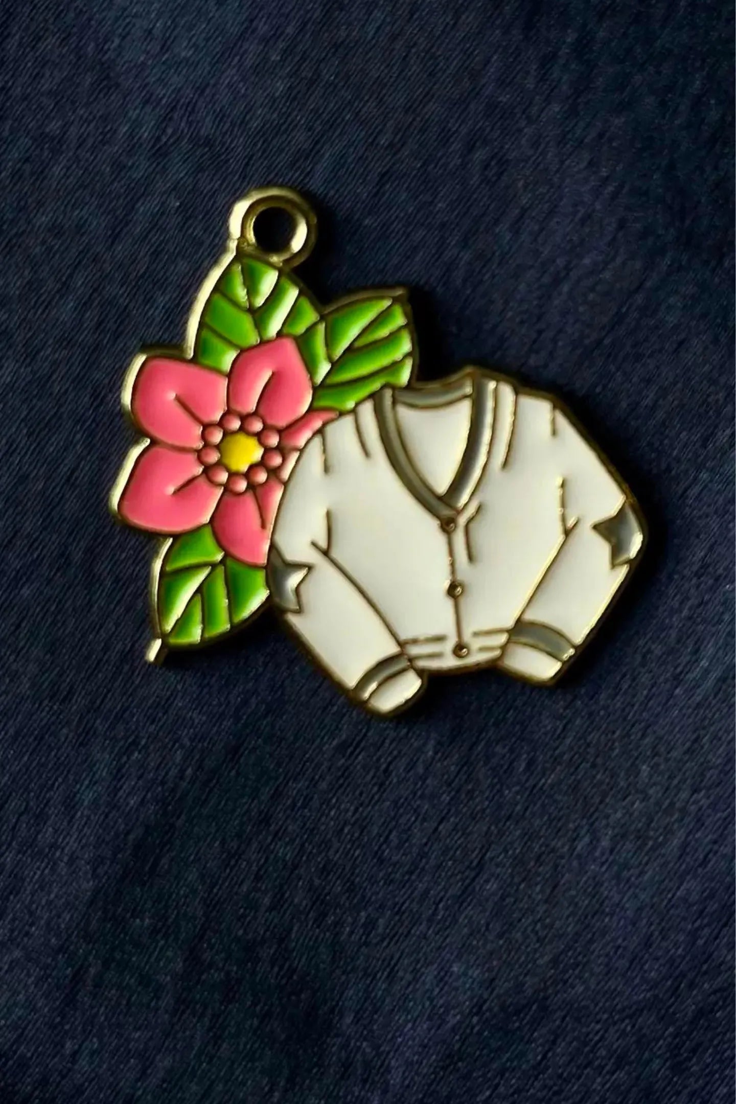 Fifth view of a cute swiftie charm featuring a Cardigan design inspired by Taylor Swift's "Folklore" album.