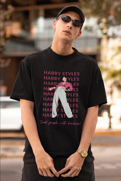 First image of male model wearing black oversized t-shirt inspired by Harry Styles, featuring the 'Treat People with Kindness' mantra from the Fine Line collection.