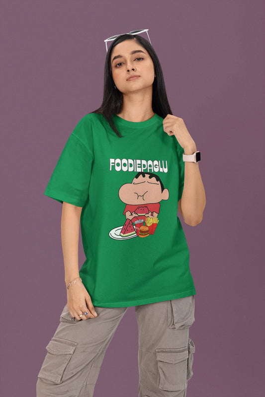 First front of a female view model wearing  a forest green oversized t-shirt featuring Shinchan eating a big meal showing his foodie side.