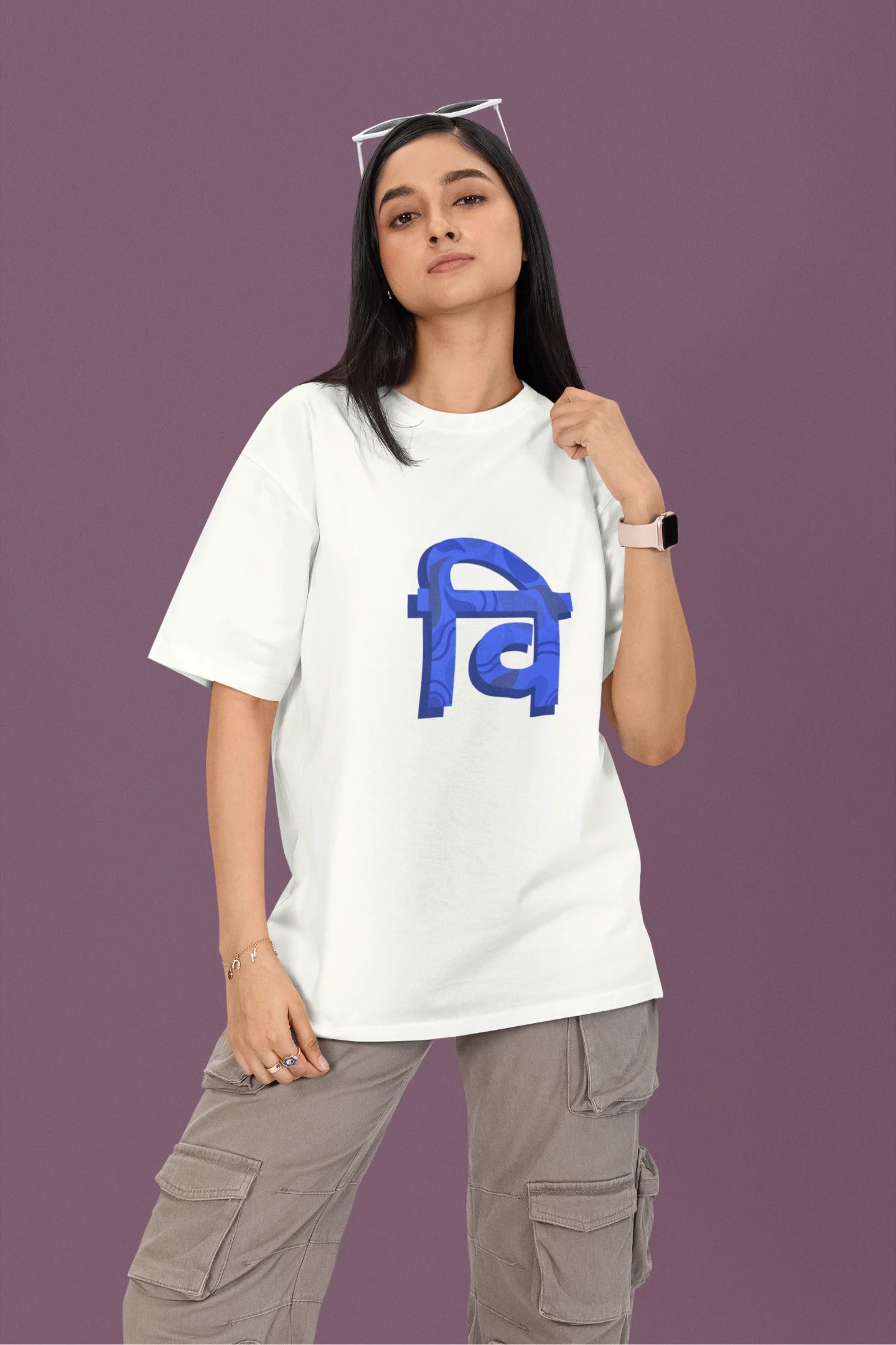 Front view of a female model wearing a white oversized tee with the phrase "Vichitra Pranee" (meaning "Strange being" or "alien") in a stylish Hindi font.