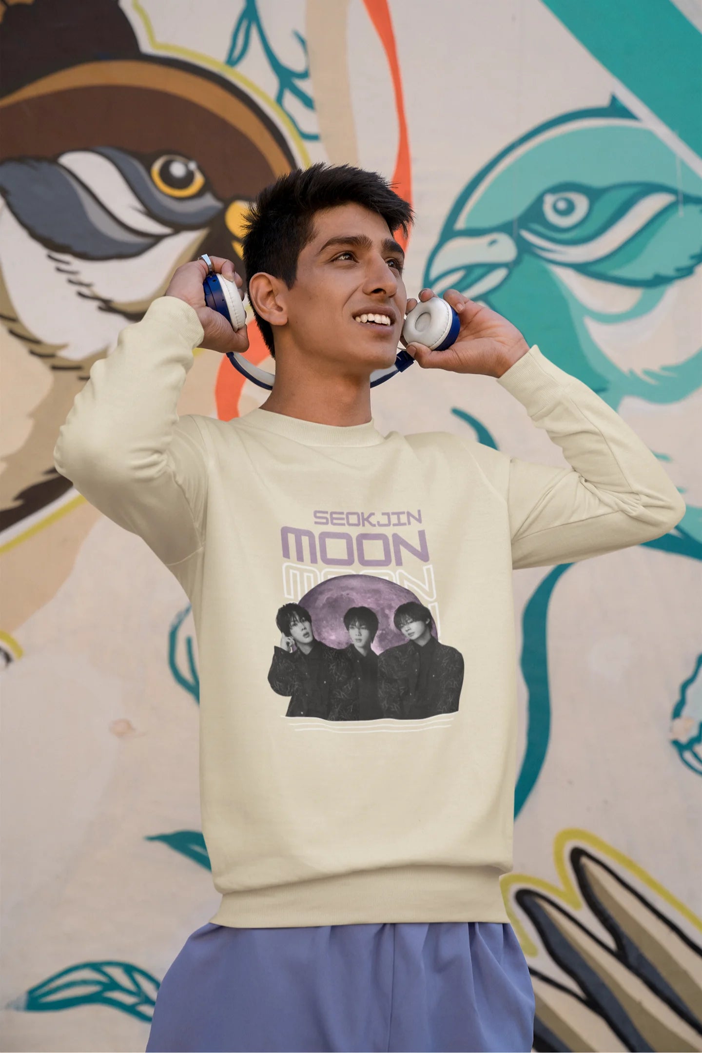 Third front view of male model wearing an cream sweatshirt featuring a unique design inspired by BTS member Jin, also known as "Worldwide Handsome." Ideal for fans of BTS and K-Pop music enthusiasts in general. 