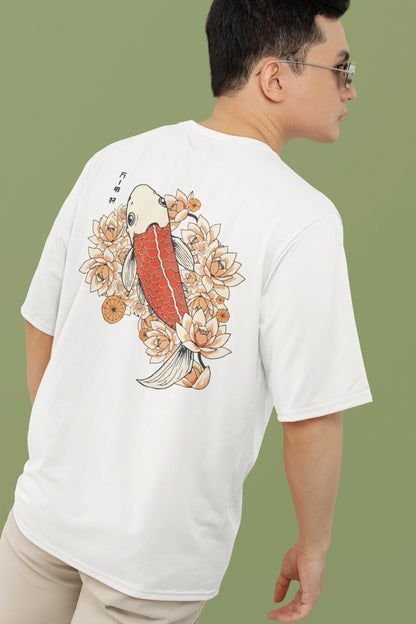 Back view of a male model wearing a off-white oversized tee with a design of a koi fish swimming in a bed of flowers.