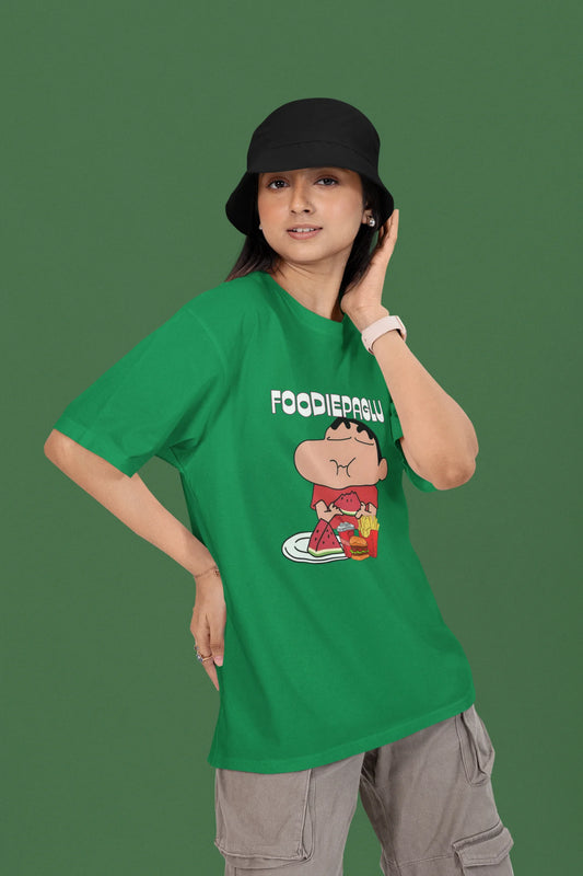 2nd front of a female view model wearing  a forest green oversized t-shirt featuring Shinchan eating a big meal showing his foodie side.