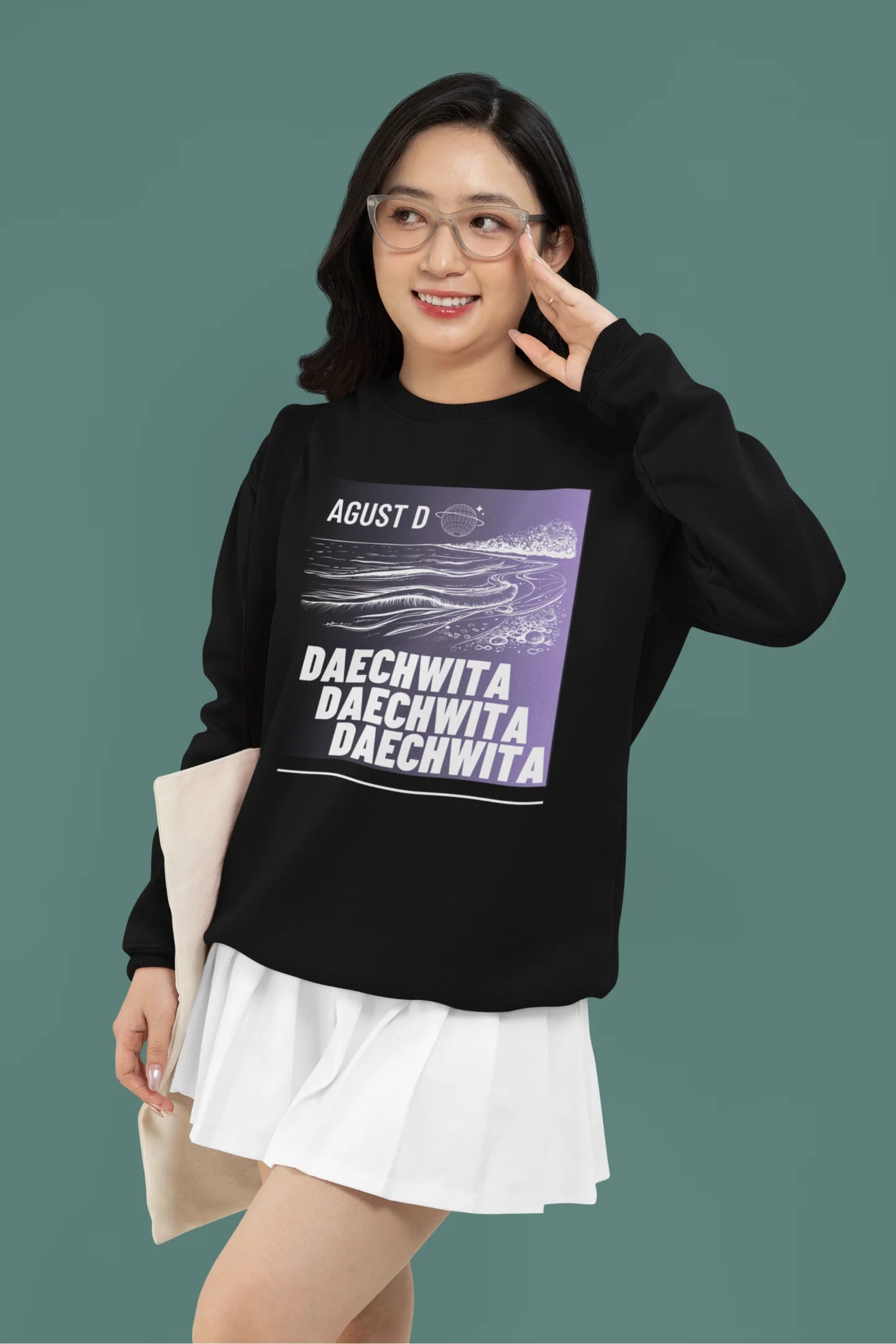 First front view of a female model wearing a black sweatshirt featuring a bold design inspired by BTS member Suga's alter ego, August D. Ideal for BTS fans (ARMY) and K-Pop enthusiasts who love rap music and artist individuality.