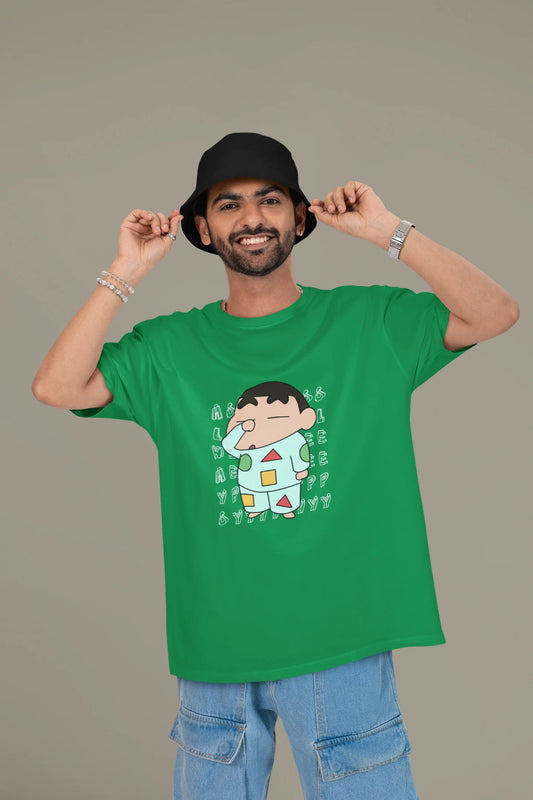 First front view of a male model wearing a forest green oversized t-shirt featuring  Shinchan looking sleepy.