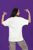 Back view of a female model wearing an off-white oversized t-shirt with the text 