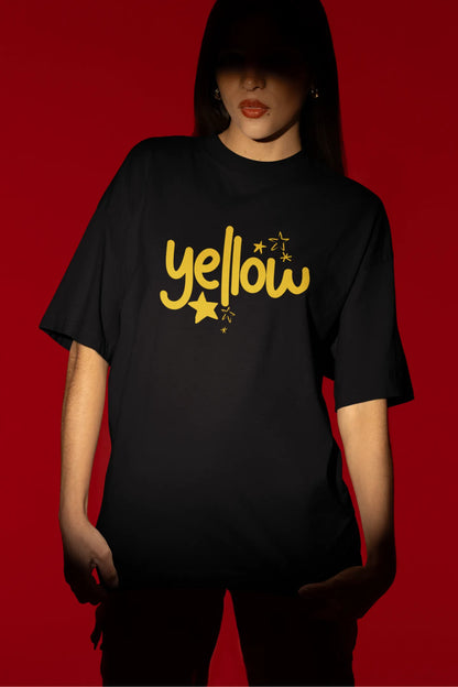 Fourth front view of a female model wearing a black oversized t-shirt with the "Yellow" album artwork by Coldplay.