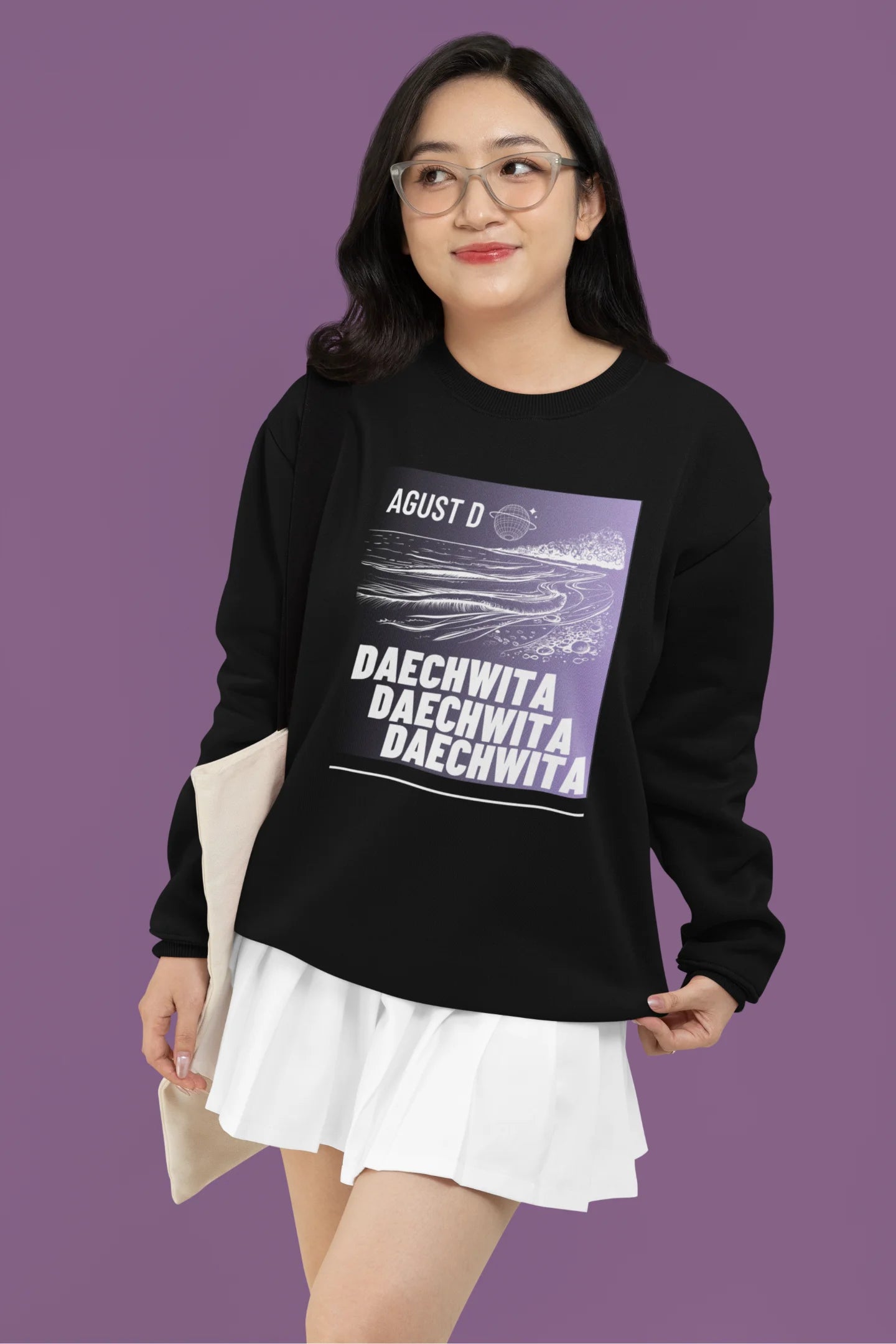 Third front view of a female model wearing a black sweatshirt featuring a bold design inspired by BTS member Suga's alter ego, August D. Ideal for BTS fans (ARMY) and K-Pop enthusiasts who love rap music and artist individuality.