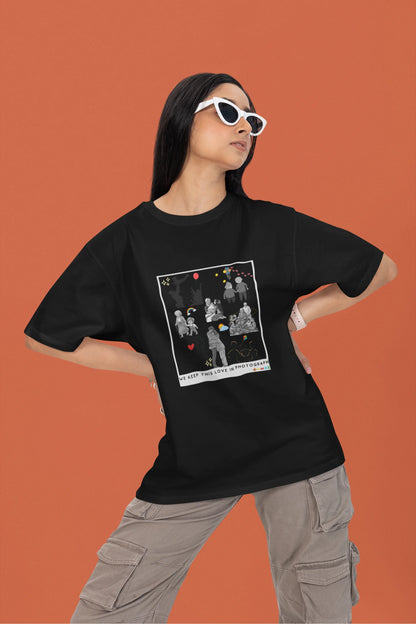 3rd front view of a female model wearing a black oversized t-shirt featuring a design that represents cherished memories, inspired by Ed Sheeran's "Photograph."
