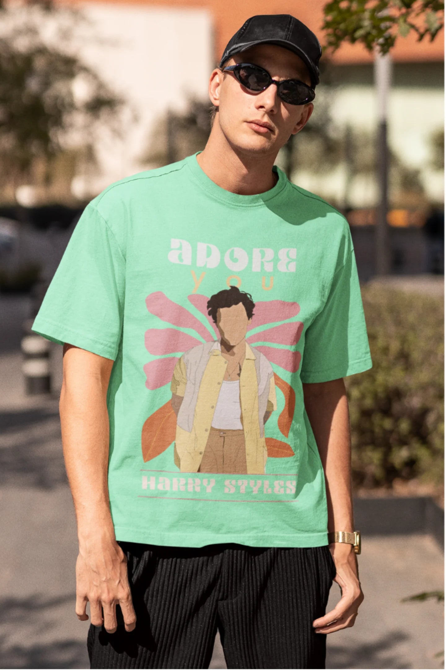 Second image of man wearing mint green oversized t-shirt featuring 'Adore You' inspired design - ideal for fans of Harry Styles and One Direction