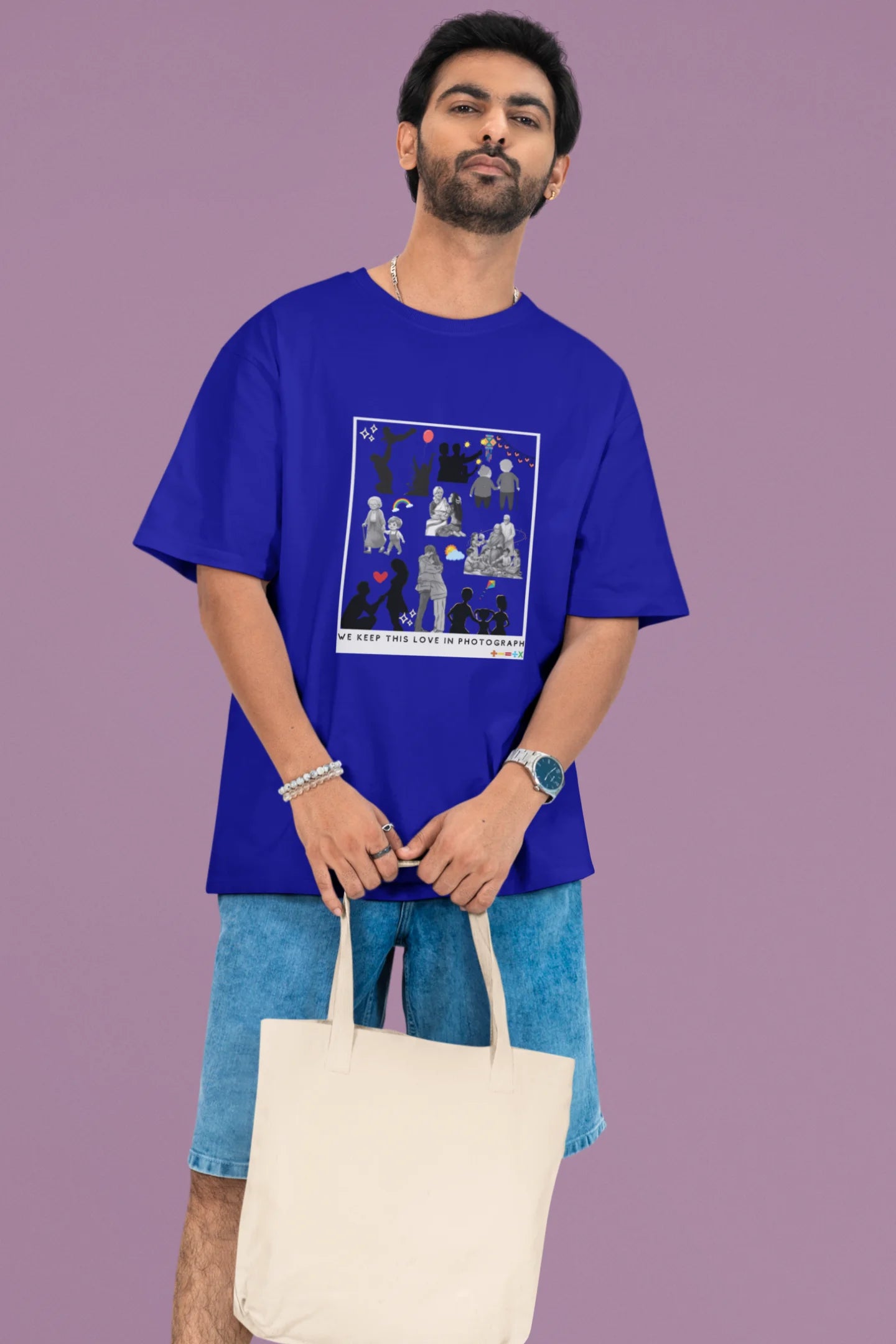 2nd front view of a male model wearing a royal blue oversized t-shirt featuring a design that represents cherished memories, inspired by Ed Sheeran's "Photograph."