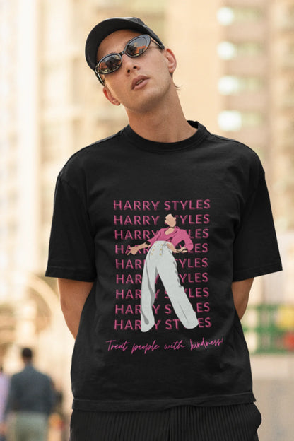 Second image of male model wearing black oversized t-shirt inspired by Harry Styles, featuring the 'Treat People with Kindness' mantra from the Fine Line collection.