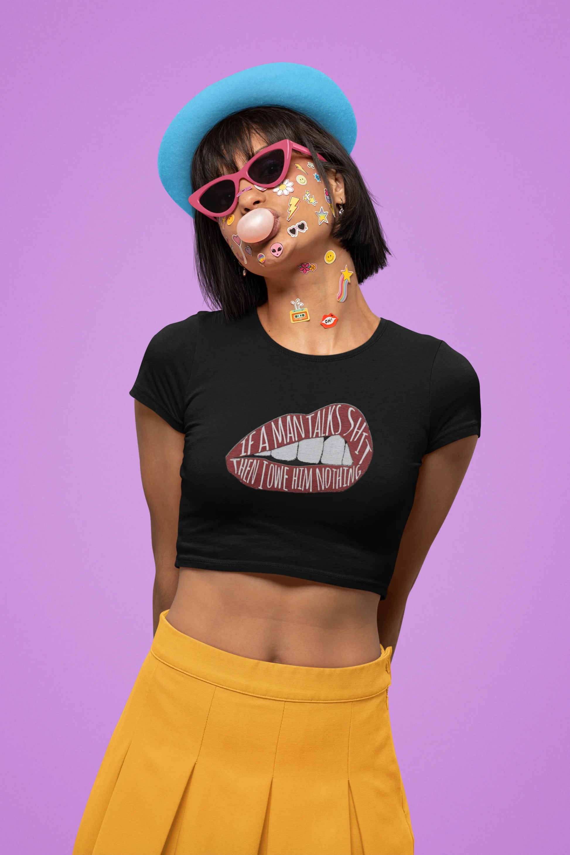 Front view of a female model wearing black crop top featuring the empowering message "You Owe Him Nothing," inspired by Taylor Swift's lyrics. This piece is a must-have for Swifties who value self-respect and independence.