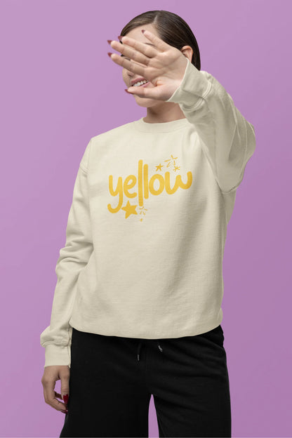 Second front view of a female model wearing a cream sweatshirt with the "Yellow" album artwork by Coldplay.