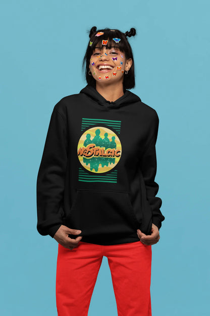 4th front view of a female model wearing an black hoodie with a shadow silhouette of the Coldplay band members and the word "Nostalgic" printed on it.