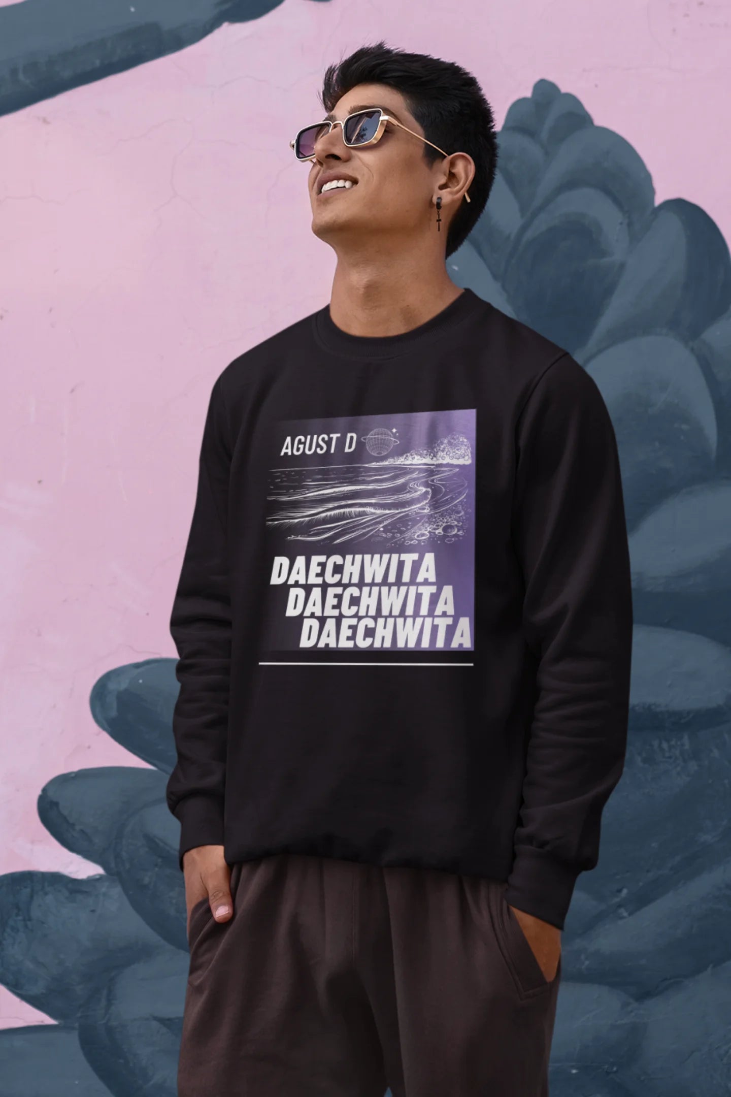 Second front view of a male model wearing a black sweatshirt featuring a bold design inspired by BTS member Suga's alter ego, August D. Ideal for BTS fans (ARMY) and K-Pop enthusiasts who love rap music and artist individuality.