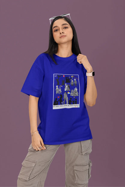 First front view of a female model wearing a royal blue oversized t-shirt featuring a design that represents cherished memories, inspired by Ed Sheeran's "Photograph."