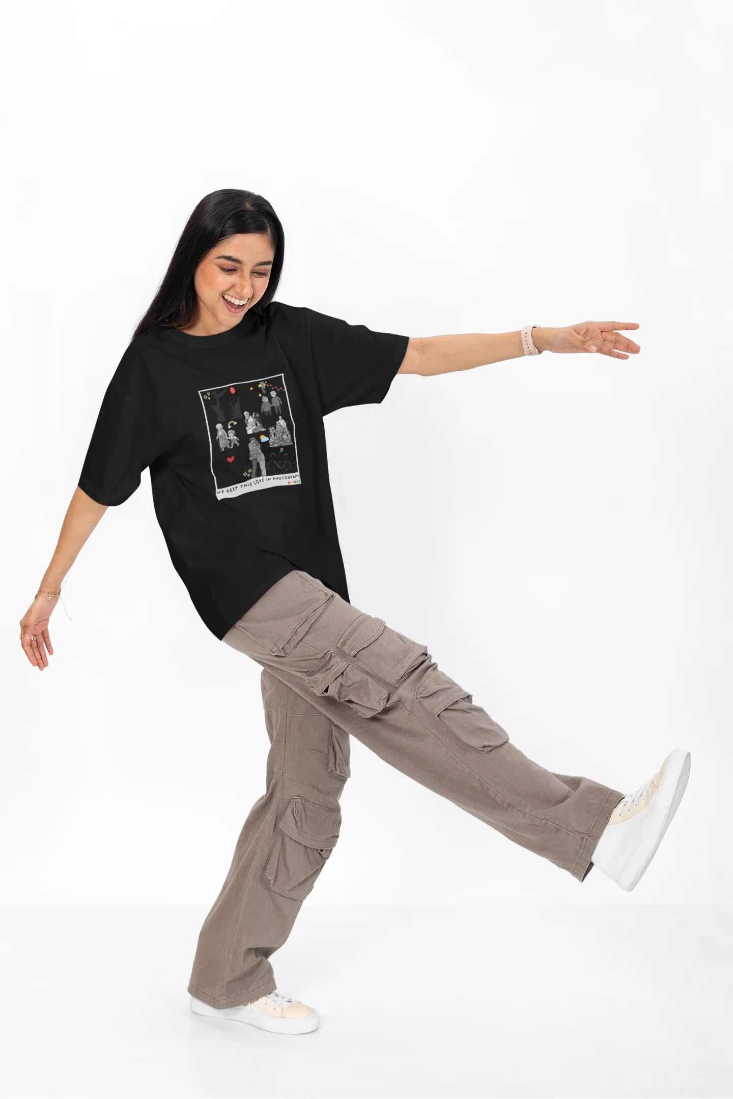 4th front view of a female model wearing a black oversized t-shirt featuring a design that represents cherished memories, inspired by Ed Sheeran's "Photograph."