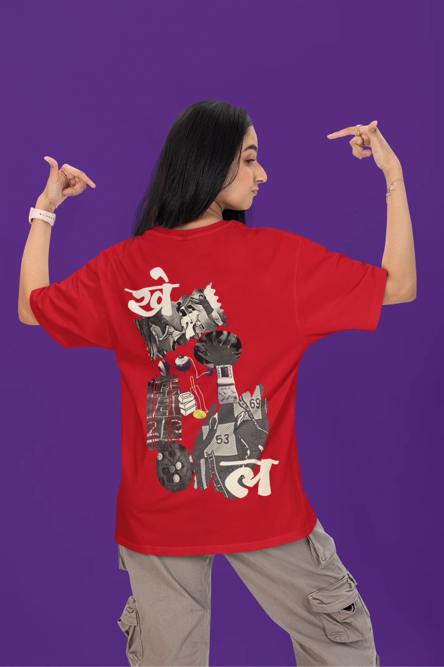 Back view of a female model wearing a red oversized t-shirt featuring a collage of illustrations or symbols representing various childhood games commonly played by kids in India.