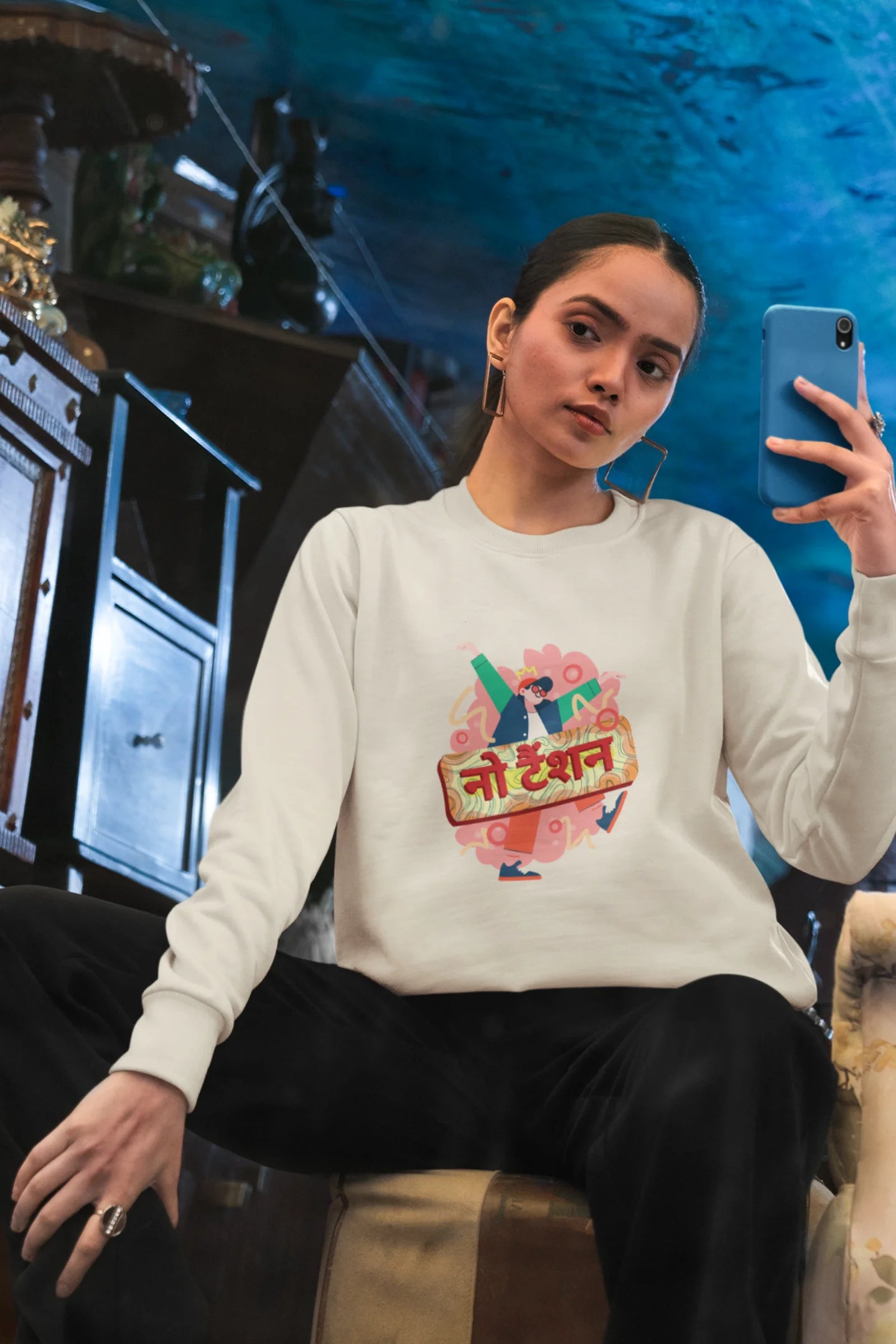 6th front view of a female model wearing a cream oversized t-shirt with the phrase "No Tension" in a relaxed, unique script.