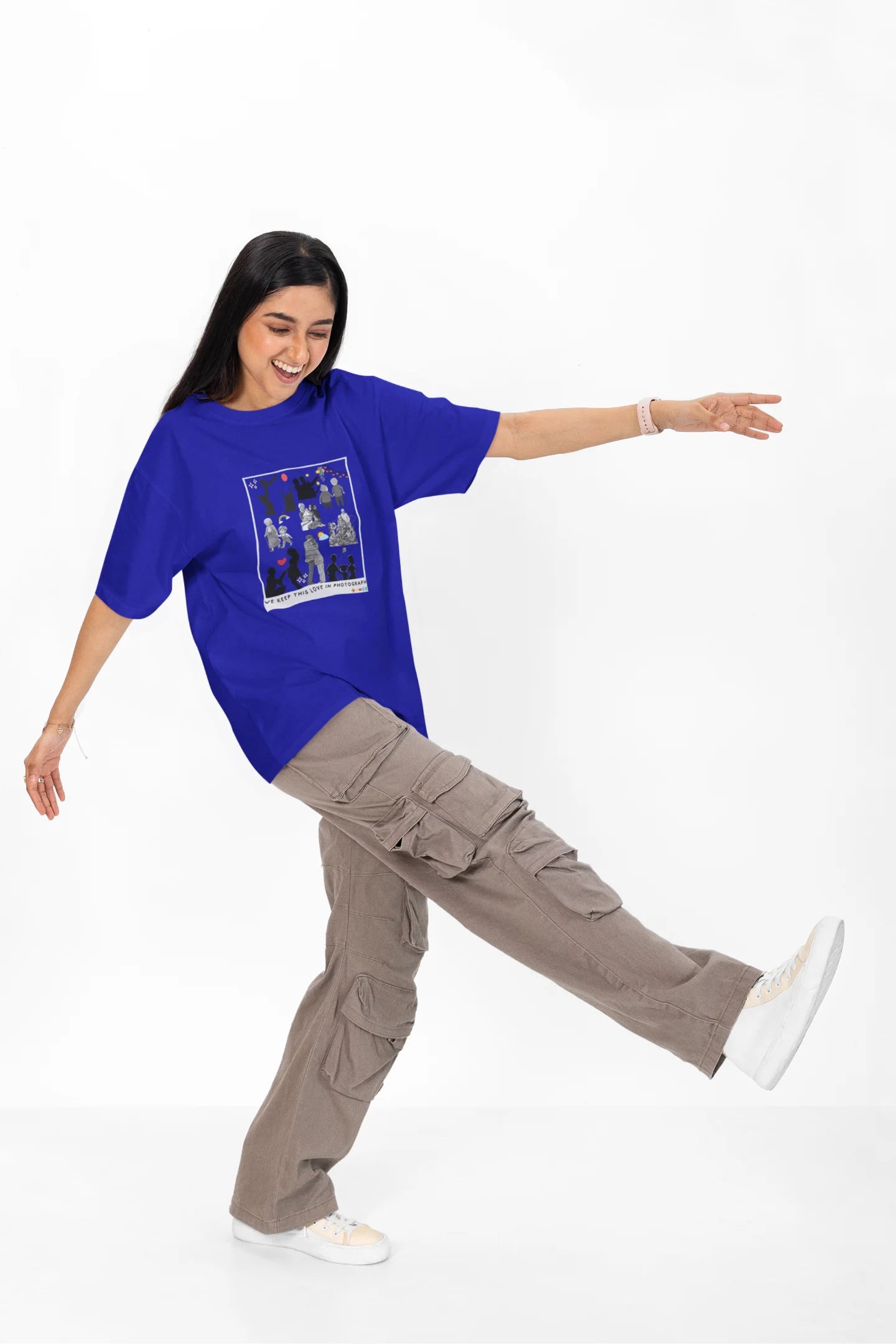 4th front view of a female model wearing a royal blue oversized t-shirt featuring a design that represents cherished memories, inspired by Ed Sheeran's "Photograph."