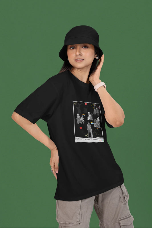 2nd front view of a female model wearing a black oversized t-shirt featuring a design that represents cherished memories, inspired by Ed Sheeran's "Photograph."