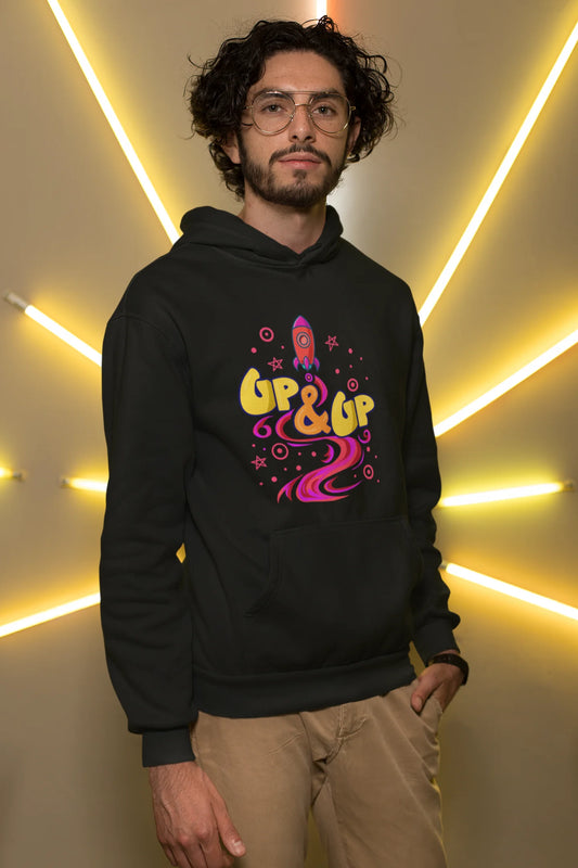 First front view of a male model wearing an black hoodie with a rocket ship design and the text "Up & Up".