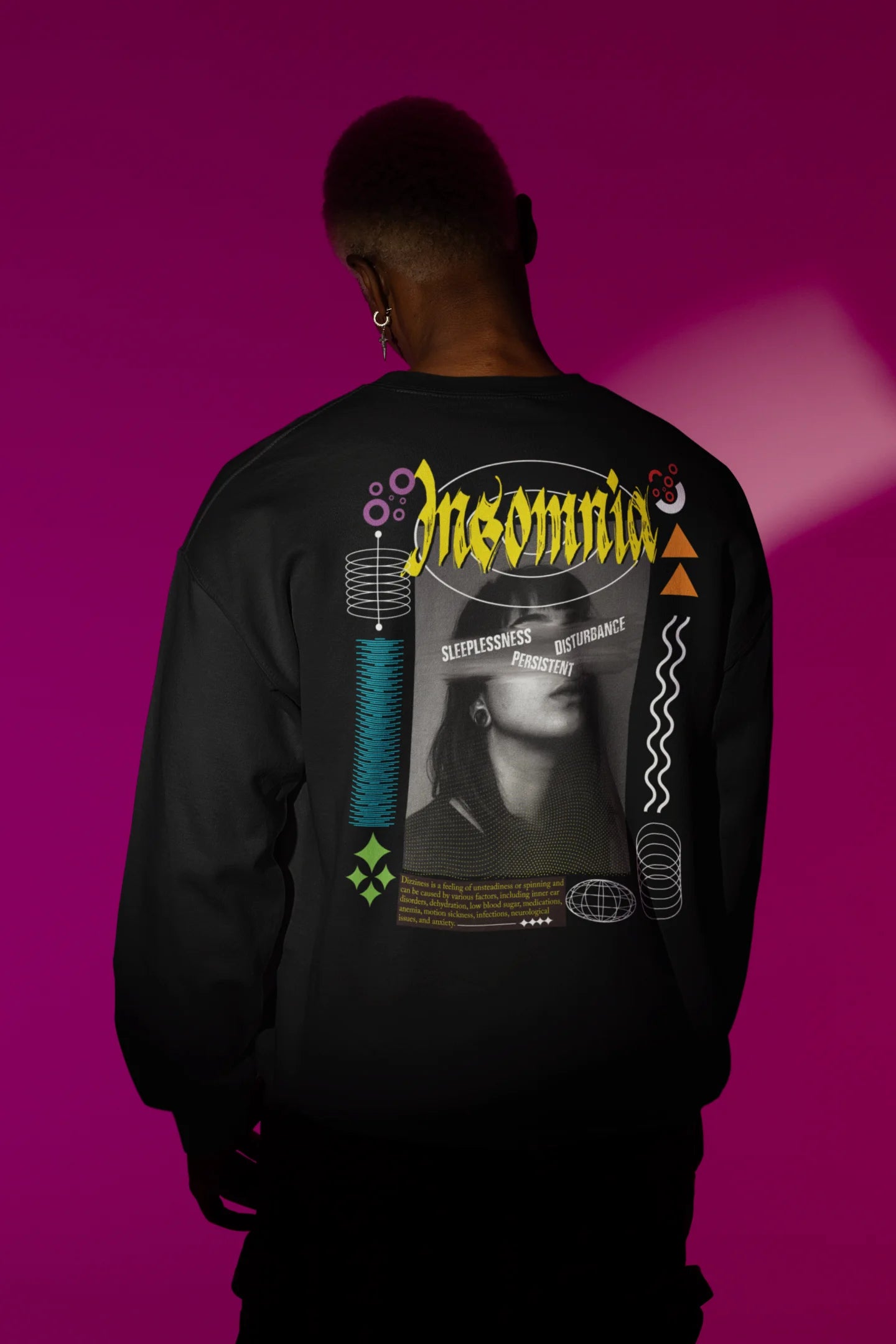 First back view of a male model wearing a brutalist-inspired black sweatshirt with "Insomnia" written in a stylized, concrete-like font.