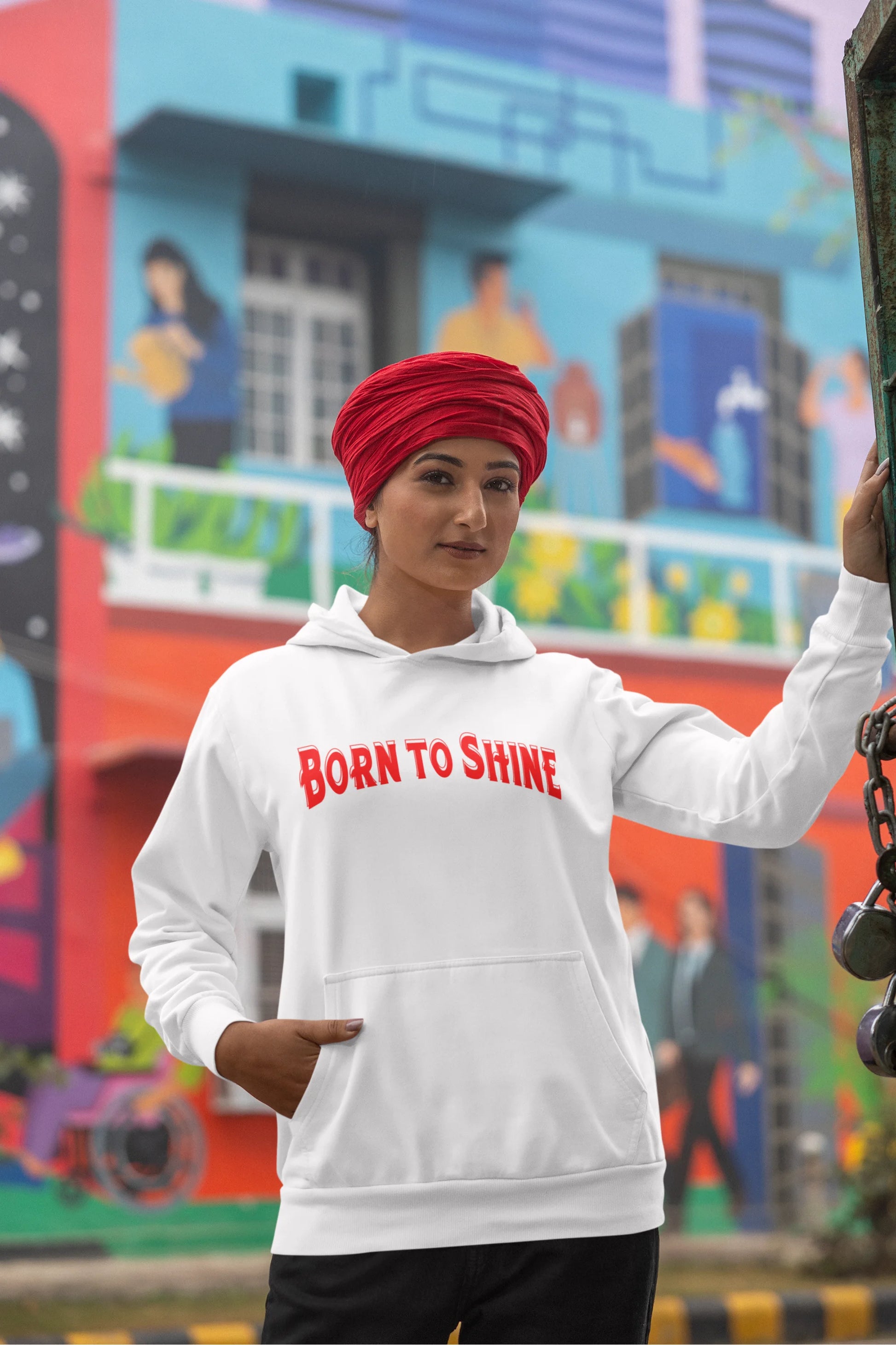 First image of a female model wearing a off-white Diljit Dosanjh hoodie with the text "Born to Shine."