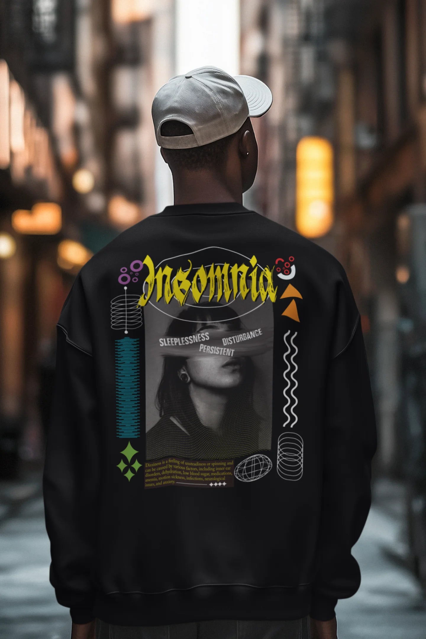 Second back view of a male model wearing a brutalist-inspired black sweatshirt with "Insomnia" written in a stylized, concrete-like font.