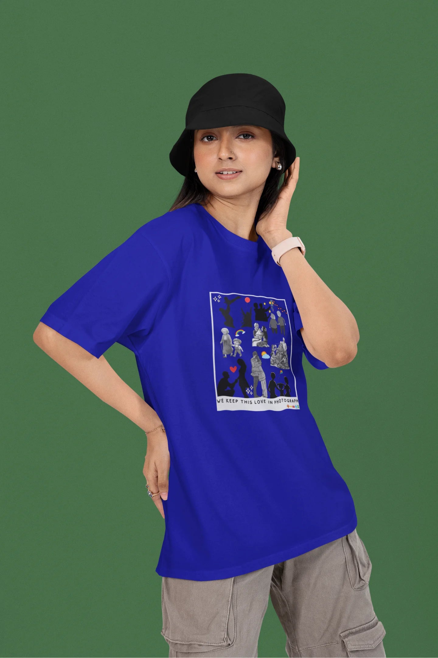 2nd front view of a female model wearing a royal blue oversized t-shirt featuring a design that represents cherished memories, inspired by Ed Sheeran's "Photograph."