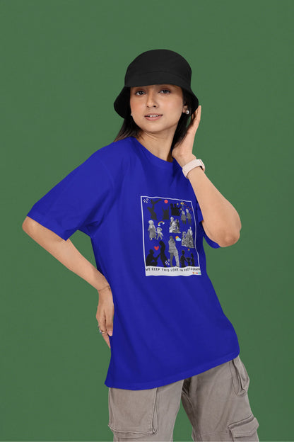2nd front view of a female model wearing a royal blue oversized t-shirt featuring a design that represents cherished memories, inspired by Ed Sheeran's "Photograph."