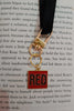 Second image of a taylor swift RED era themed keychain for swifties.