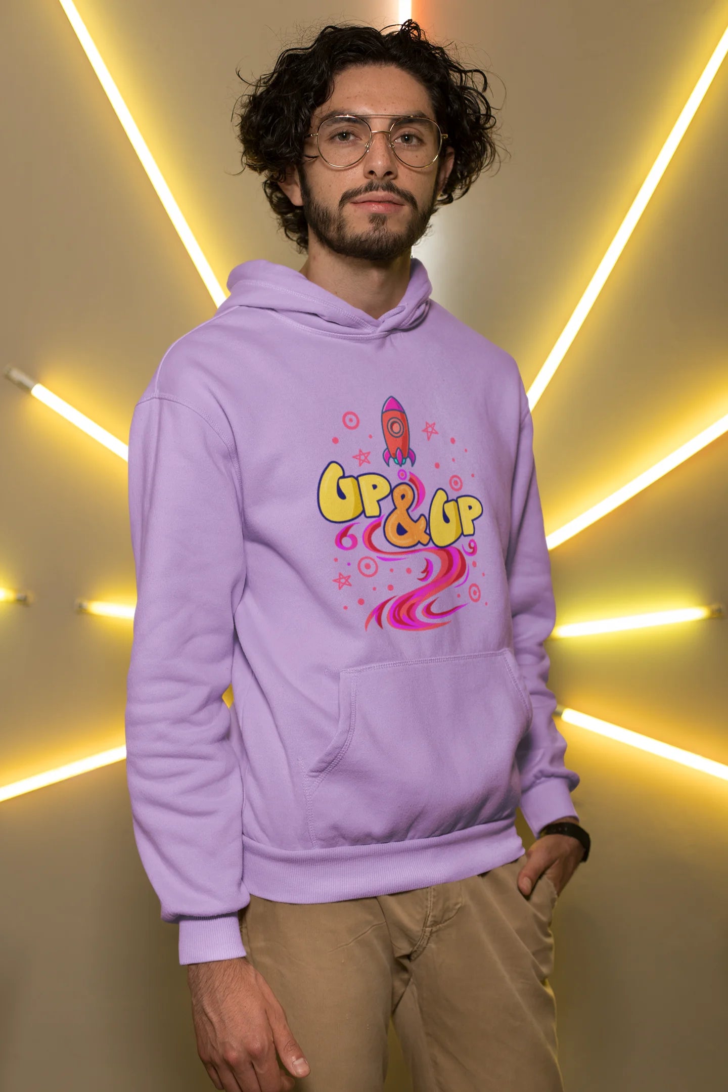 First front view of a male model wearing an lavender hoodie with a rocket ship design and the text "Up & Up".