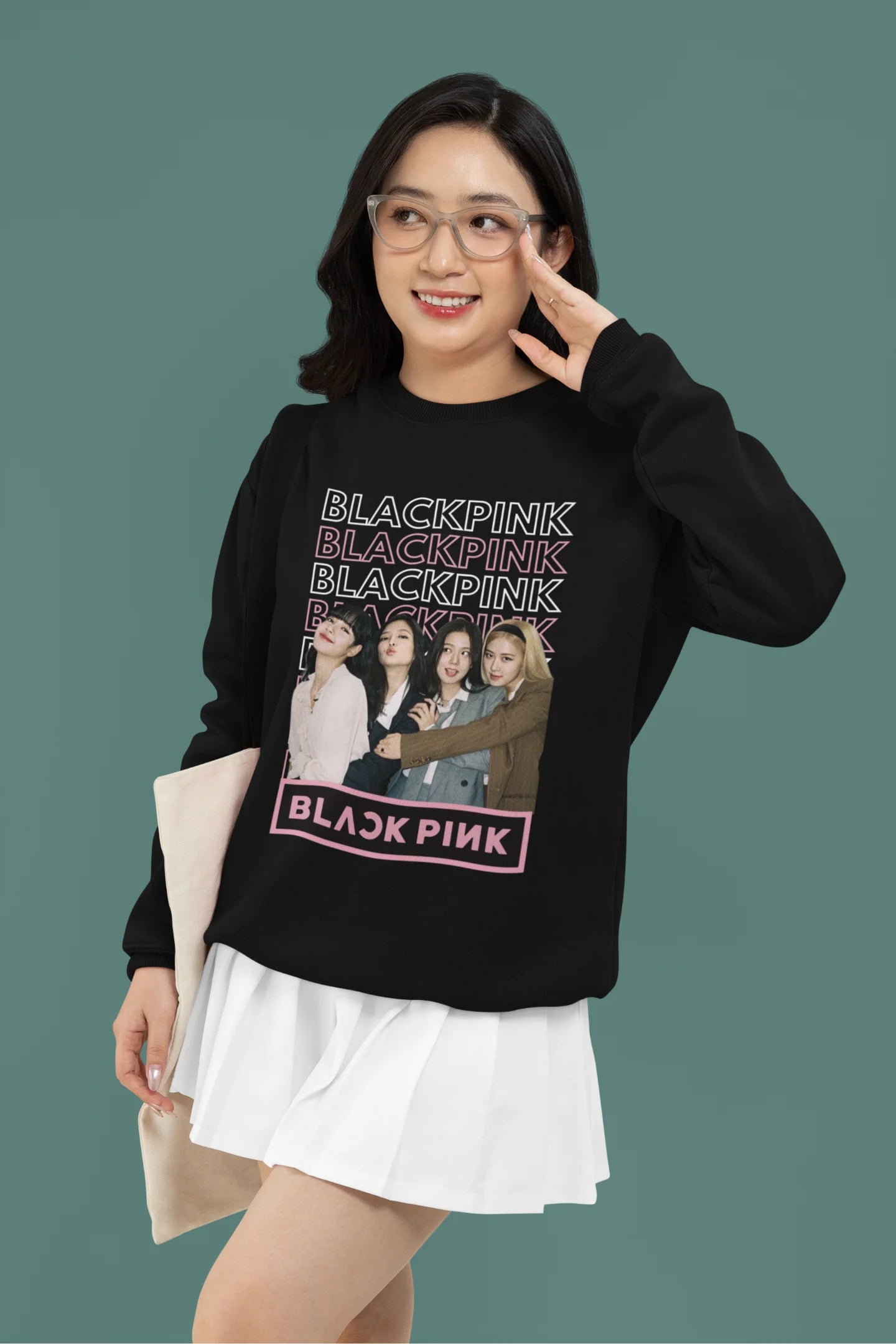 Second front view of a female model wearing a black sweatshirt featuring a stylish design inspired by the K-Pop girl group Blackpink. Ideal for Blinks (Blackpink fans) and K-Pop music enthusiasts.