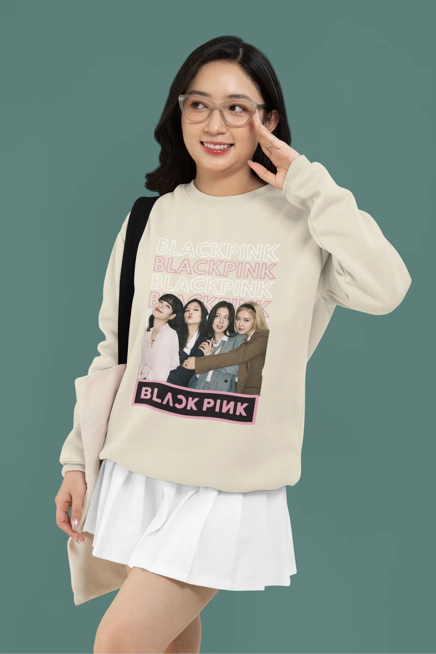 First front view of a female model wearing a cream sweatshirt featuring a stylish design inspired by the K-Pop girl group Blackpink. Ideal for Blinks (Blackpink fans) and K-Pop music enthusiasts.
