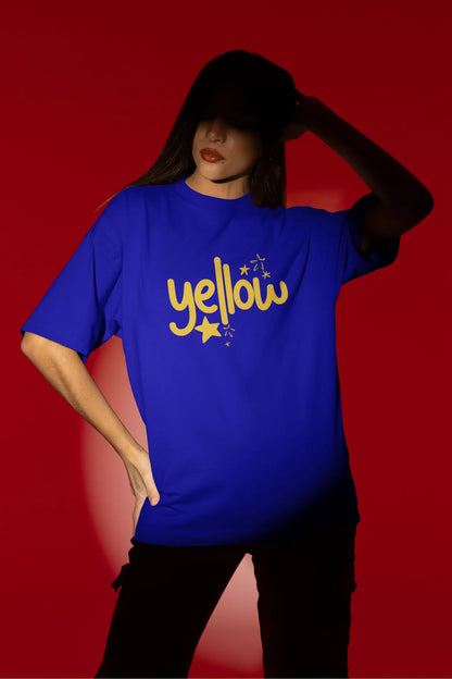 First front view of a female model wearing a royal blue oversized t-shirt with the "Yellow" album artwork by Coldplay.