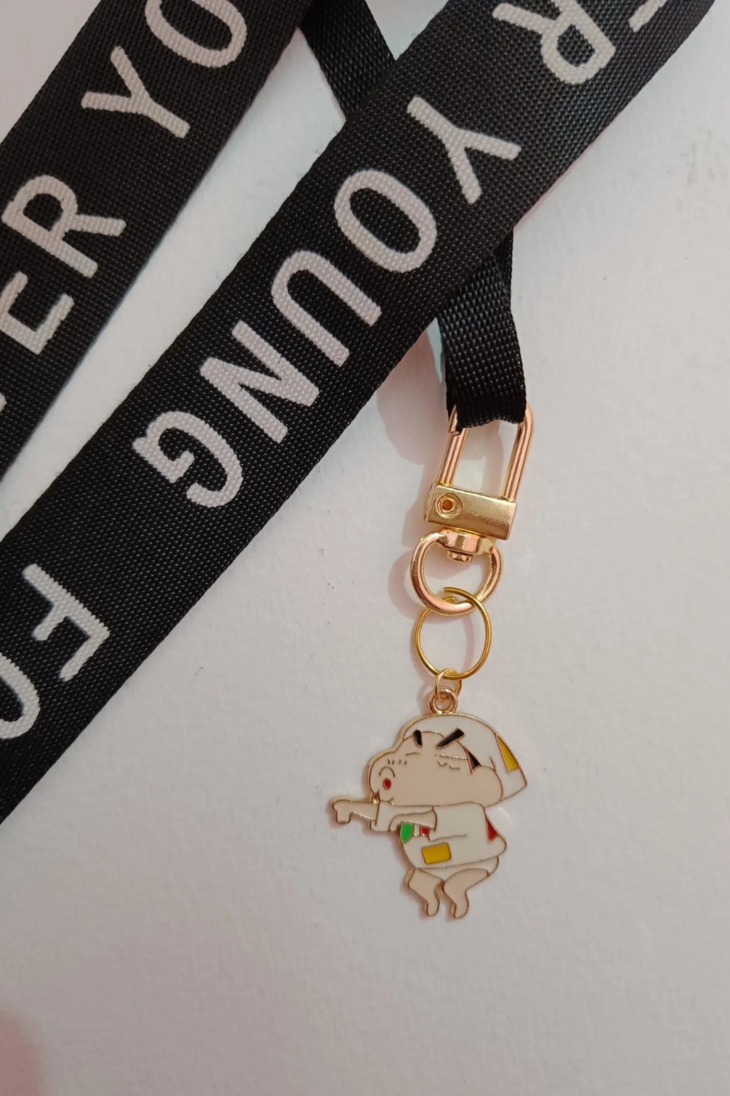 Second view of a keychain featuring a mischievous Shinchan design. Perfect for Shinchan fans.
