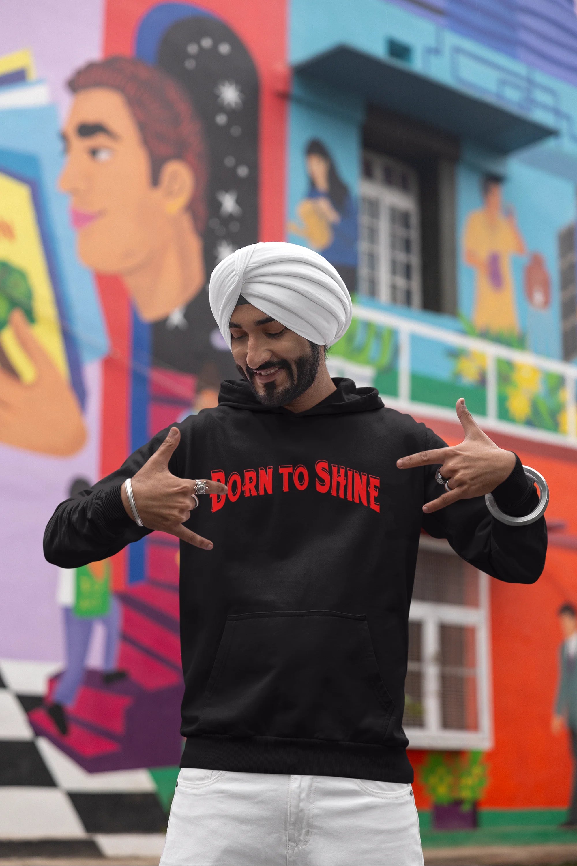 Fourth front view of a male model wearing a black Diljit Dosanjh hoodie with the text "Born to Shine."