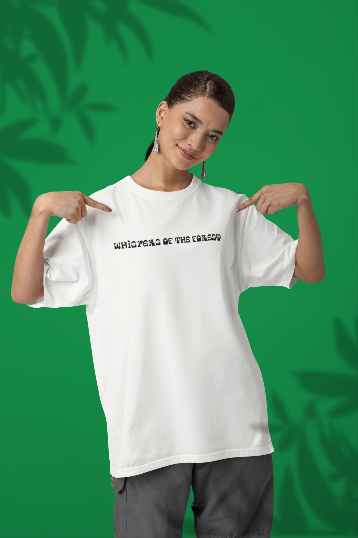 2nd front view of a female model wearing a off-white oversized tee with a design featuring three different types of butterflies, symbolizing the beauty and diversity of nature.
